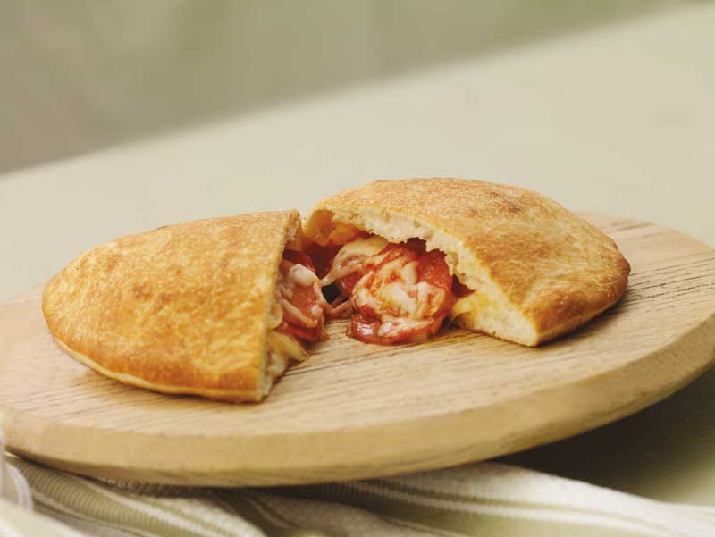 A calzone oozing out its filling