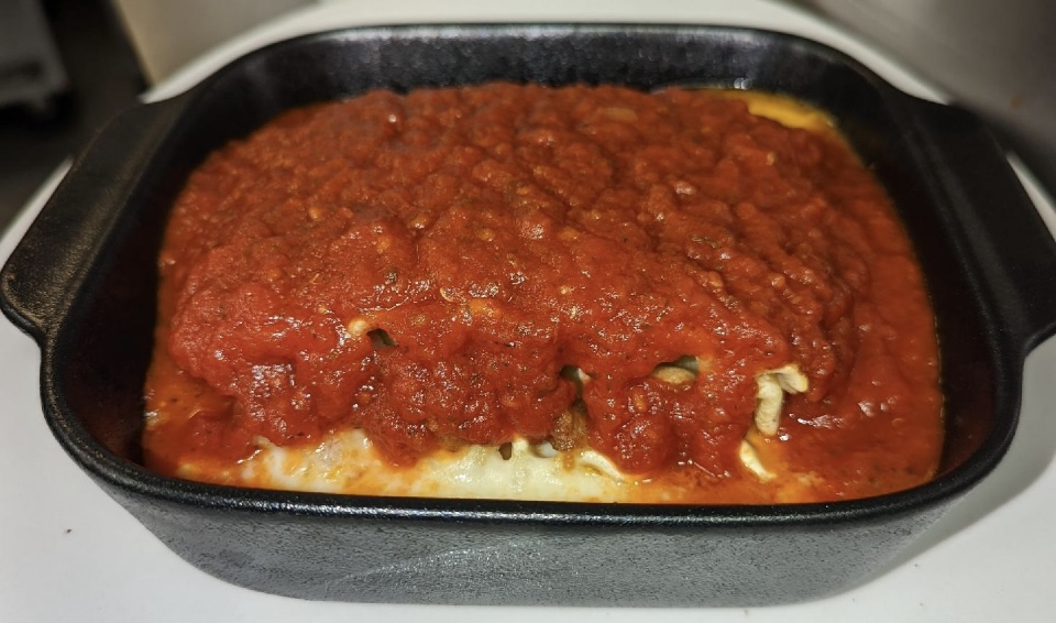 A hot and fresh lasagna with cheese and sauce